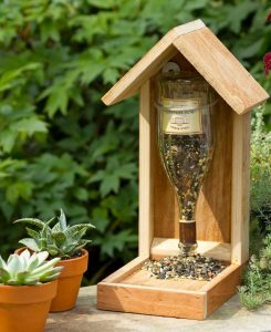 https://www.budgetdumpster.com/blog/wp-content/uploads/2017/09/2017-0905-reusing-glass-jars-and-bottles-bird-feeder-245x300.jpg
