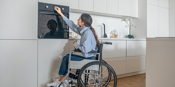 Woman in Wheelchair Cooking With Wall Oven