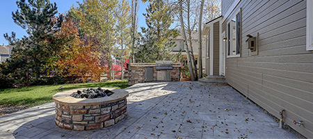 Stone Fire Pit on Patio in Backyard