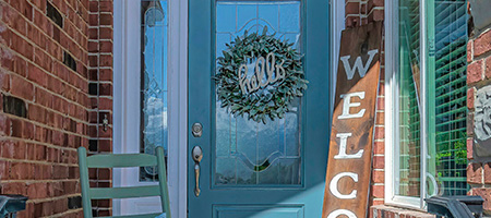 Front Door With Flowers, Rocking Chair and Wreath