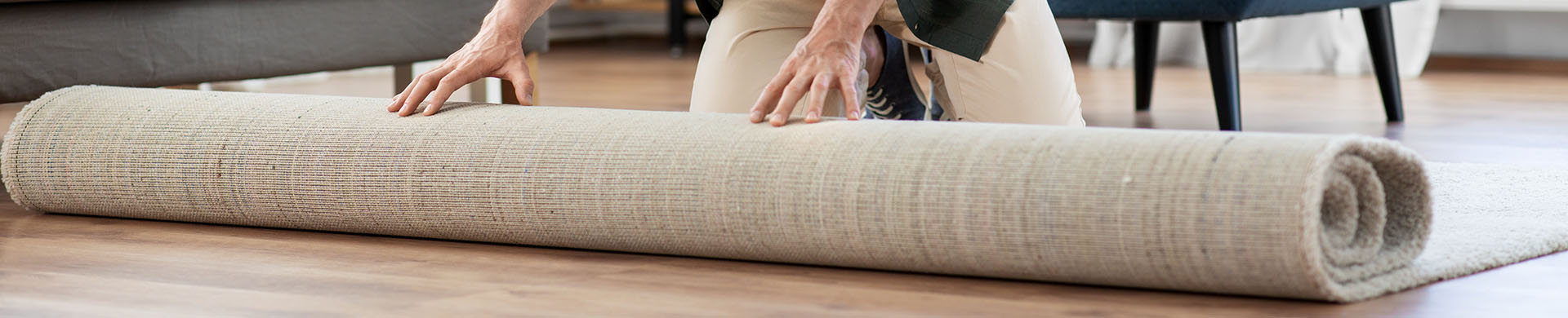 Man Decorating Living Room With a New Rug