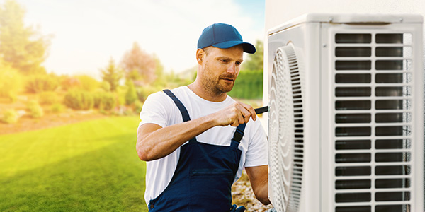 Man Installing HVAC Unit Outside