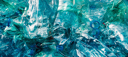 Pile of Crushed Blue Plastic Bottles