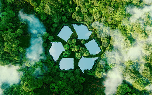 Lake in Shape of Recycling Sign Surrounded by Green Trees