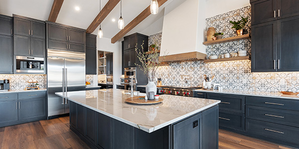 Home Kitchen With Mosaic Tiles, Dark Cabinets and Wood Flooring