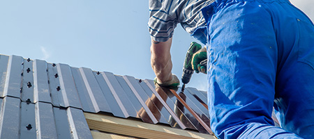 A contractor replacing an outdated roof. 