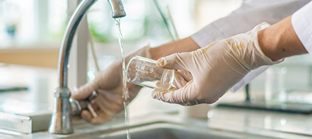 Homeowner Testing Their Tap Water