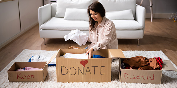 Woman Sorting Items to Donate, Keep or Discard