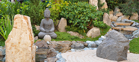 Zen Garden With Boulders, Statues and River