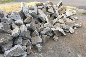 Concrete chunks on the ground of a jobsite.