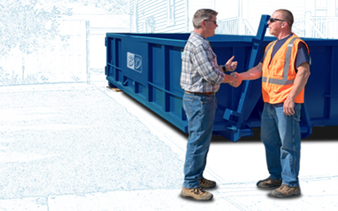 Two men shaking hands in front of a blue roll off dumpster.