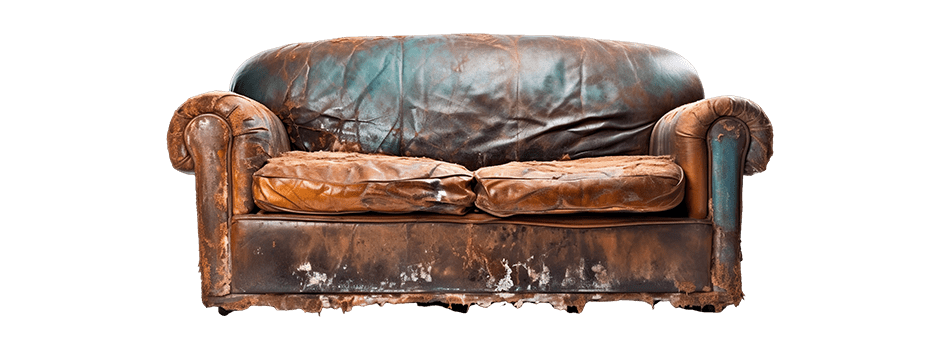 An tattered old couch waiting for disposal. 