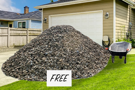 Free Sign on Pile of Rocks in Front Yard